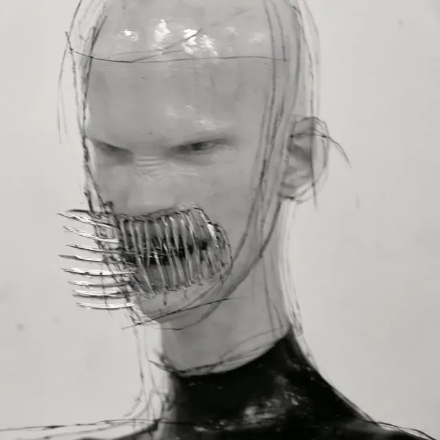 portrait of an androgynous person with sharp, and metallic teeth that resemble large spines or claws. their skin is clear transparent like glass, and they're wearing black latex attire against a white background. the details are hyper-realistic, with a futuristic aesthetic and a surreal style. the image has a high resolution and soft studio lighting, and it appears to be like a sci-fi photography piece shot with a canon eos r5.